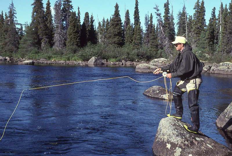 women-fly-fishing-from-a-rock.jpg