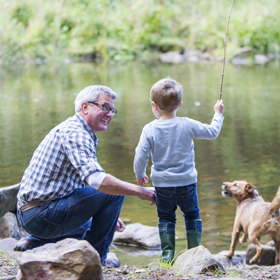 grandad and grandson fishing together