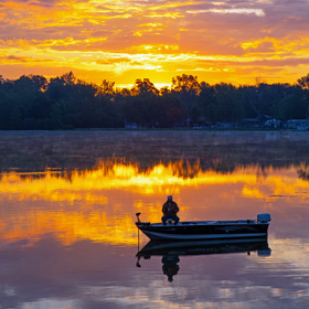 small fishing boat sunset