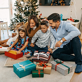 Kids opening gifts during the holidays