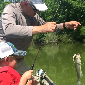 Ken Schultz taking his grandkids fishing