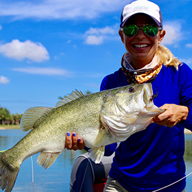 Woman holding largemouth bass