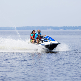 Couple jet skiing