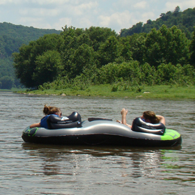 kids tubing on a lake 