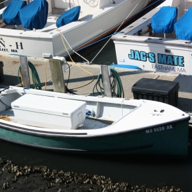 small outboard fishing boat in a marina
