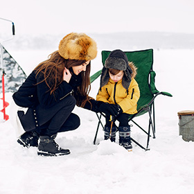 Woman and child ice fishing