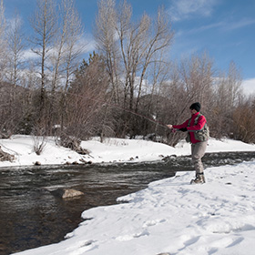 Person fishing in the snow