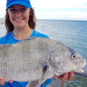 Angler fishing at one of miami fishing piers