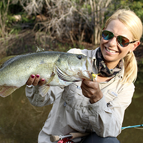 Woman holding largemouth bass