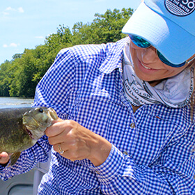 Woman holding largemouth bass