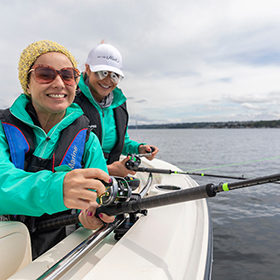 Women fishing from boat