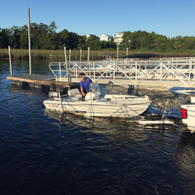 People launching a boat