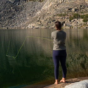 women fishing on a lake