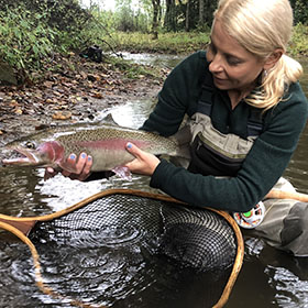 woman fly fishing