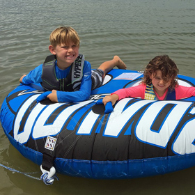 kids having tube towing