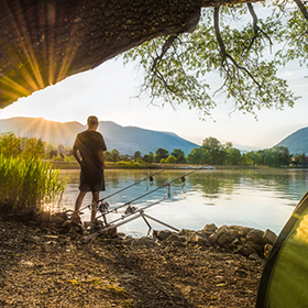 Man at campsite fishing