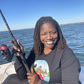 Woman fishing on a boat