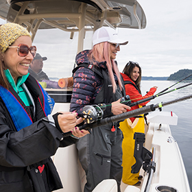 Women fishing from boat