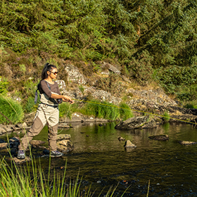 Woman fly fishing