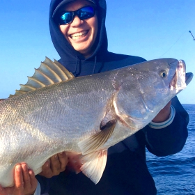 two anglers hold huge white seabass while Dana Point Fishing