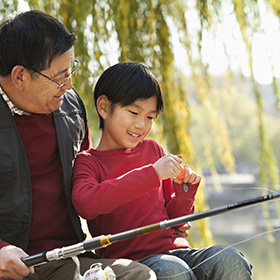 Grandfather and grandson fishing