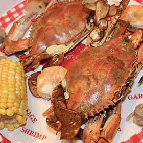 Cooked crabs with potatoes and corn