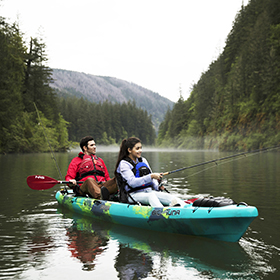 Dad and daughter fish from a kayak in Oregon