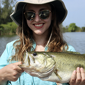 Woman holding largemouth bass