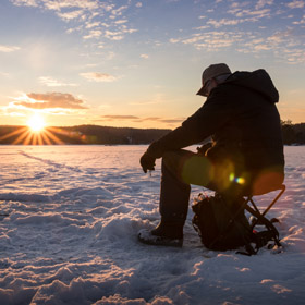 man ice fishing 