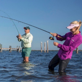 a couple enjoying their Fishing Vacations 