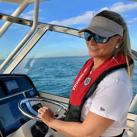 woman navigating a boat