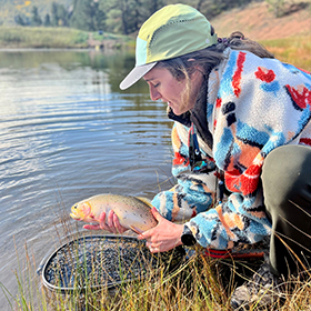 Woman holding trout