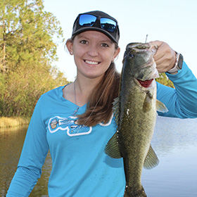 Girl holding a largemouth bass