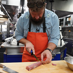 chef cutting shashimi with AFTCO knife