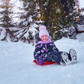 Little girl sledding