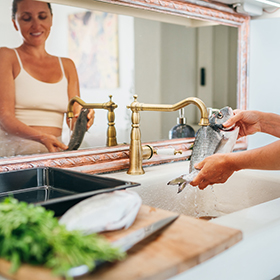 Woman cleaning fish