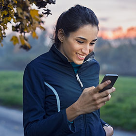 woman buying a fishing license on her phone