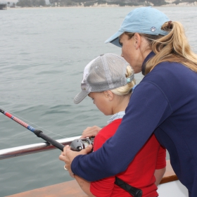 mom and son fishing during National Fishing Boating Week