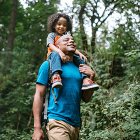 Father and son walking in the woods