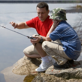 Father and son following rock fishing safety tips