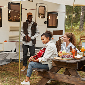 Group of people enjoying an RV picnic